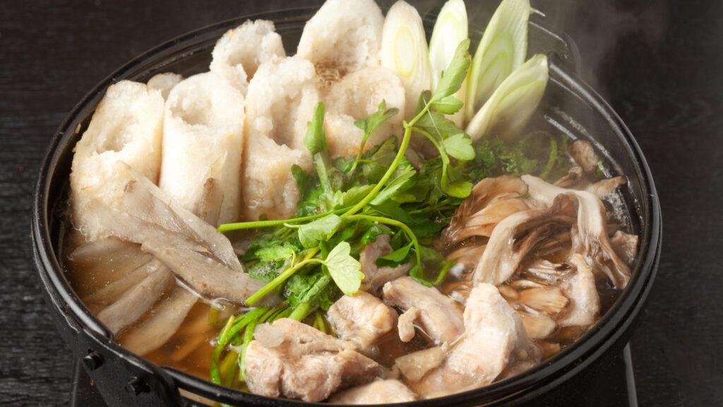 pot dish containing rice cakes and vegetables (New Year's dish)