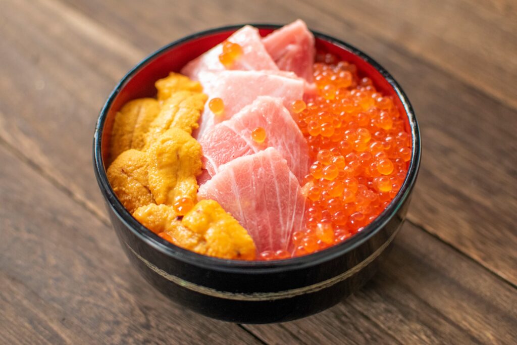 bowl of rice topped with seafood, called Kaisendon